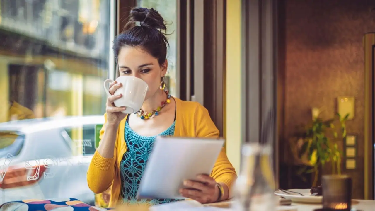 College girl in coffee shop - how to talk to college kid about money