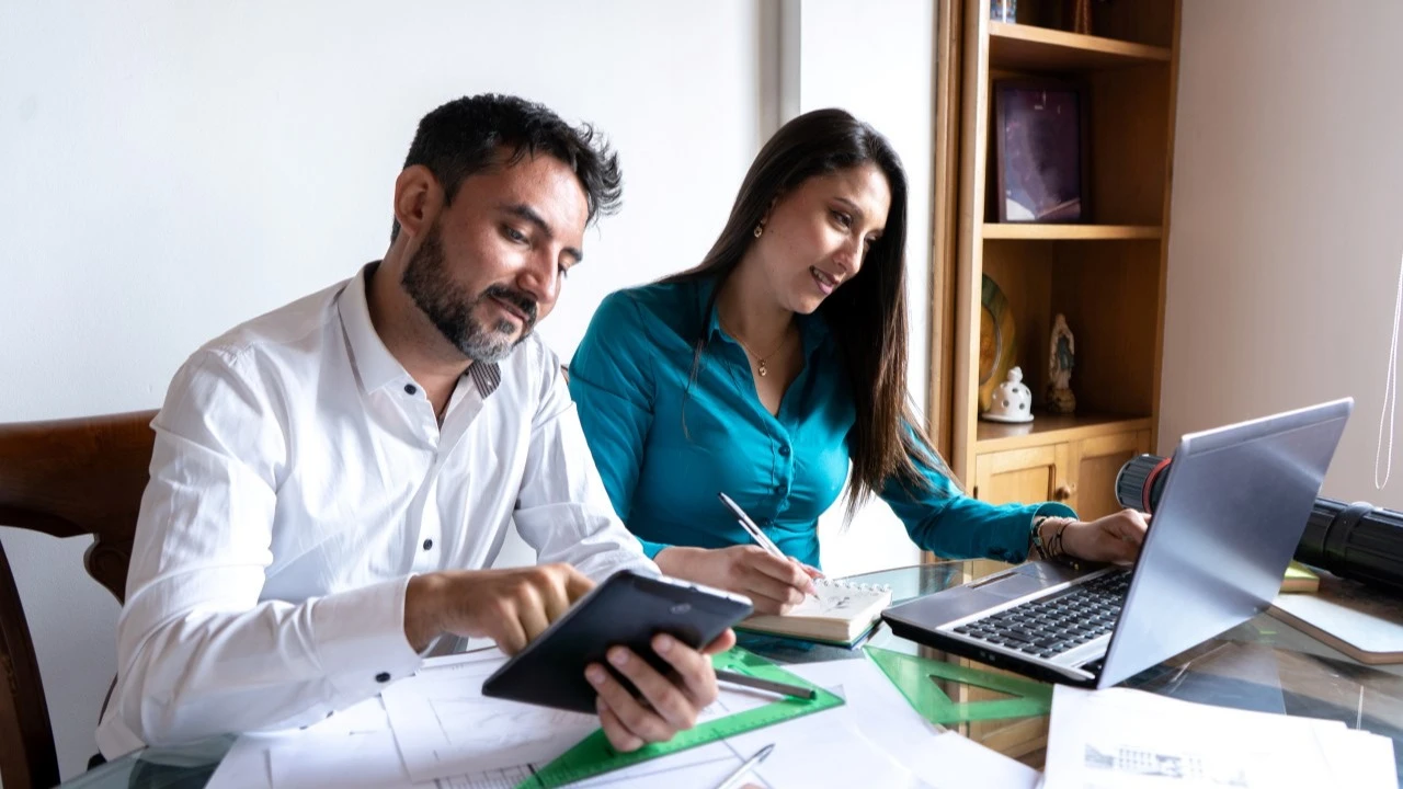 Couple working on finances together at home