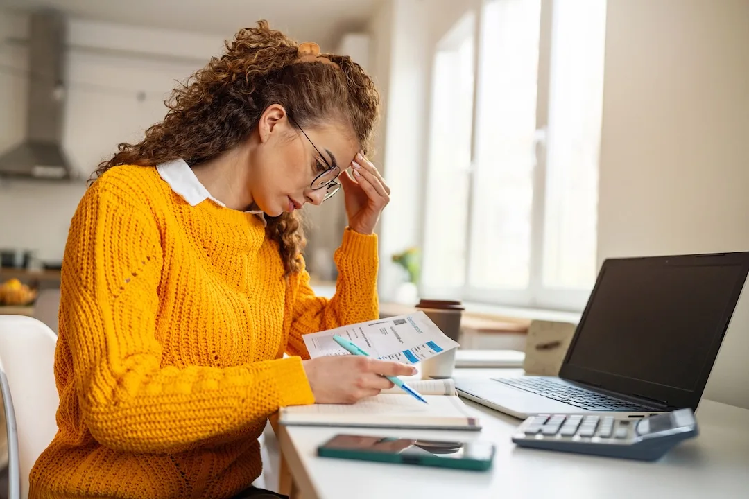 Woman considers household bills