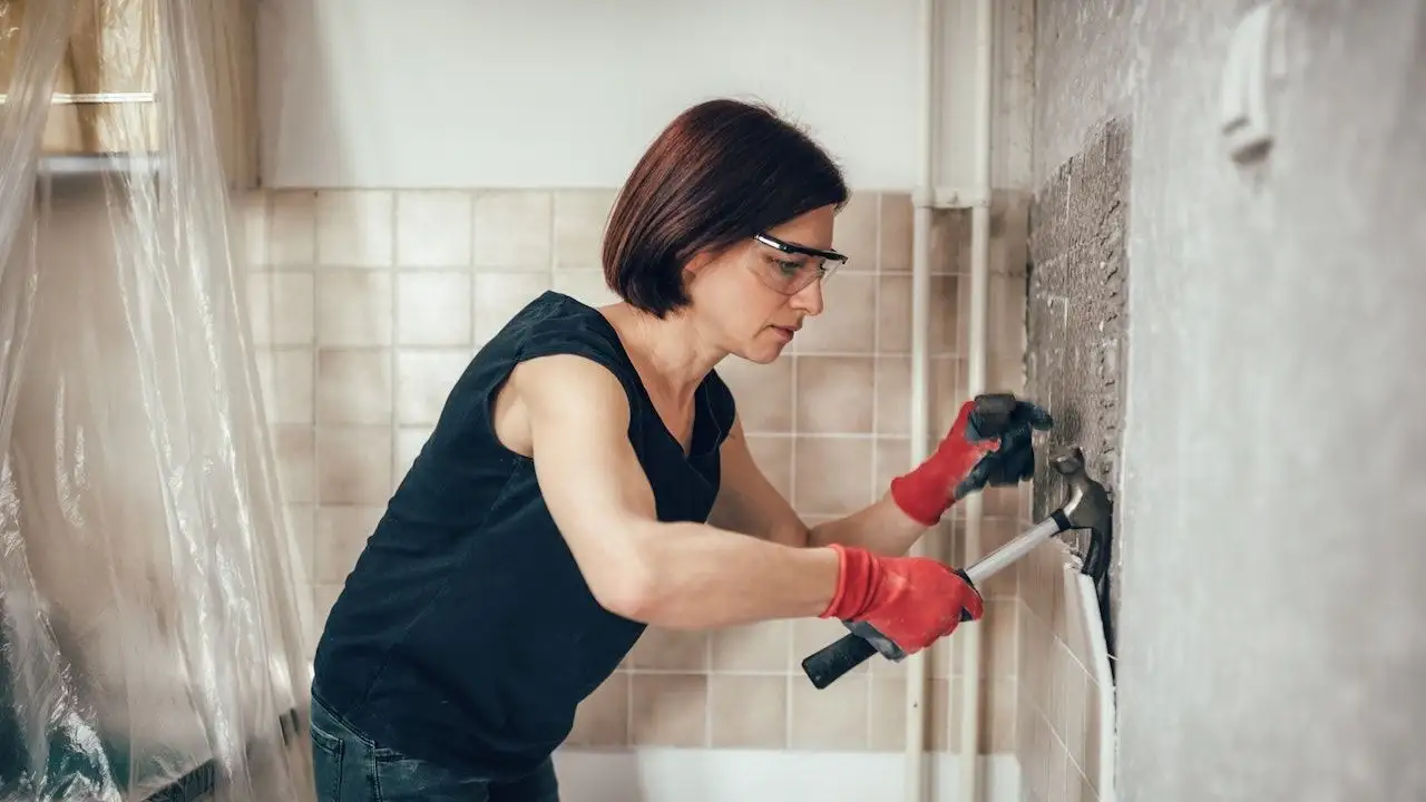 Woman doing emergency home repairs