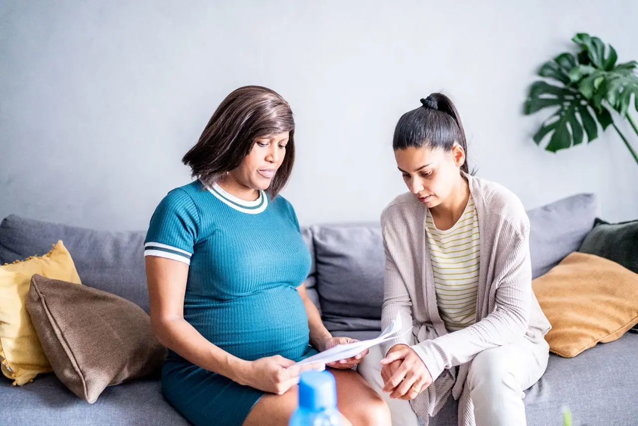 Pregnant lesbian couple worried about finances at home