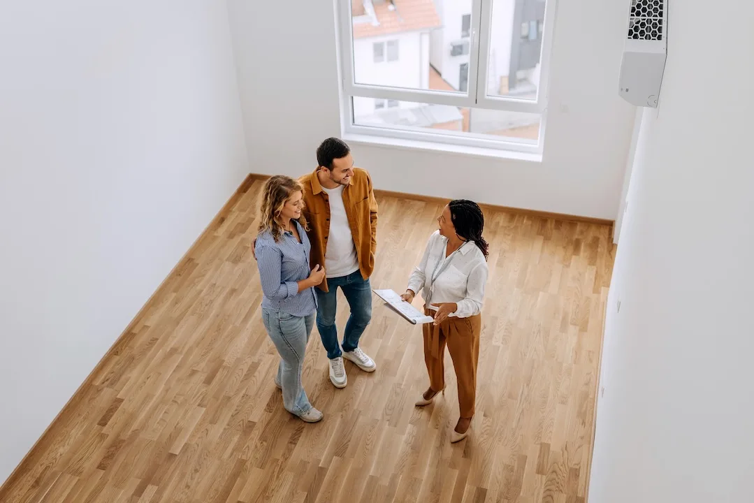 Couple looks at real estate with agent