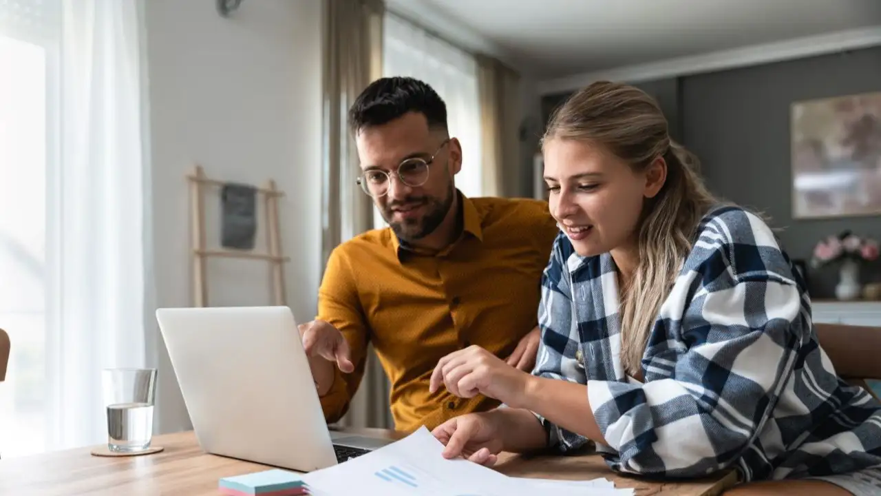 Young couple revieing student loan consolidation opportunities