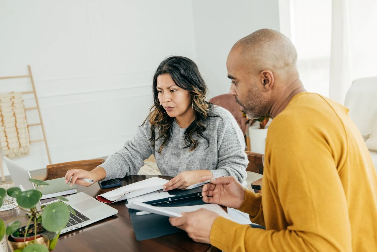 Family finances - husband and wife calculating home expenses