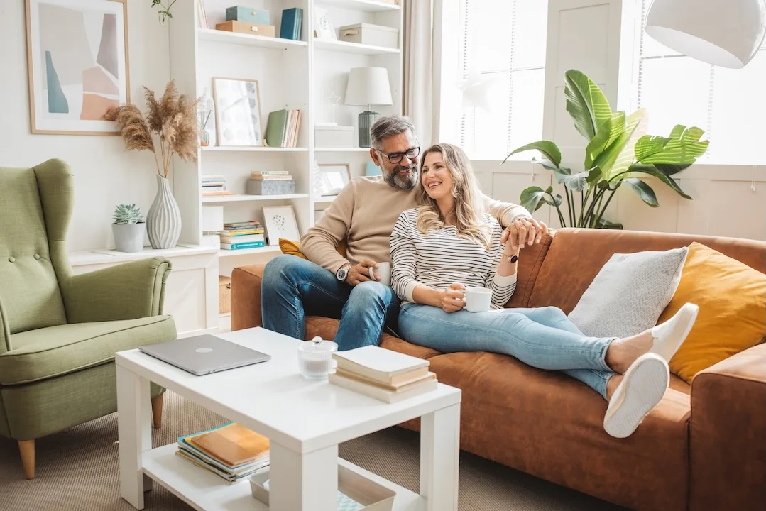 Couple relaxes in their living room. 