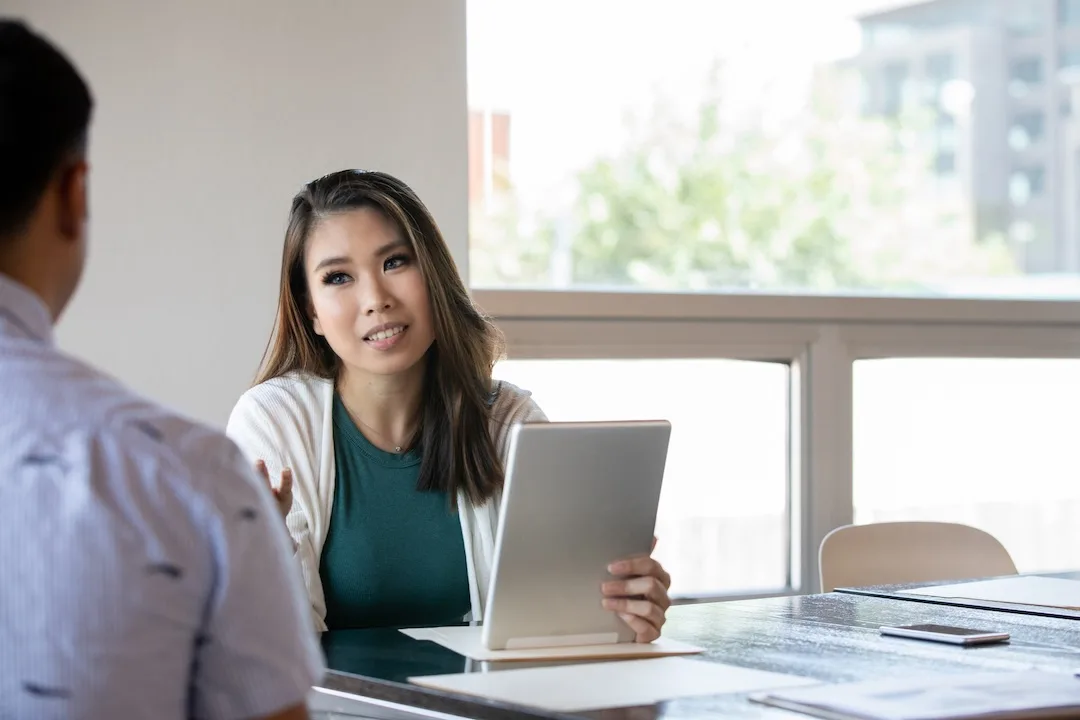 Lender talks to borrower. 