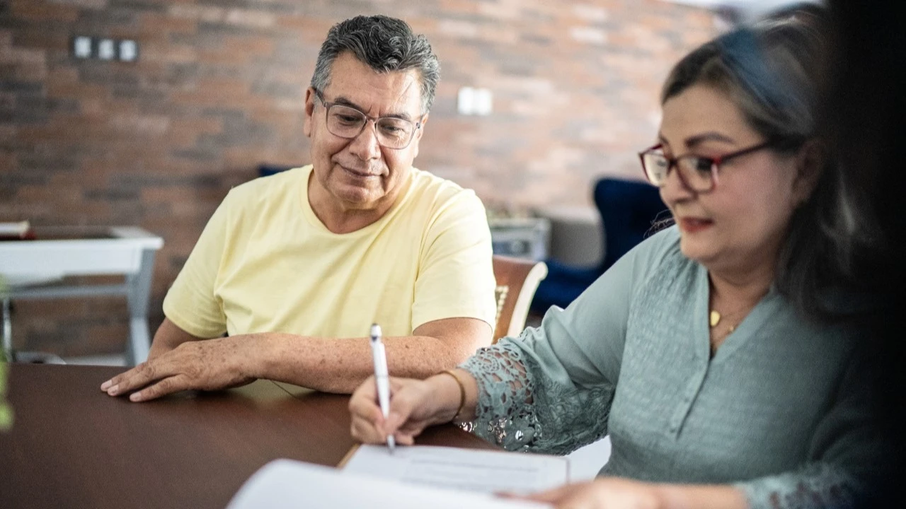 Senior couple reviewing loan documents